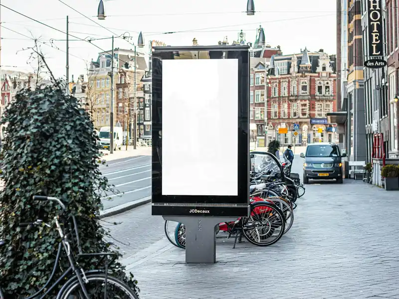 A street poster stand on a city pavement