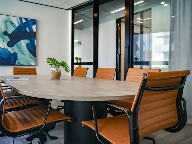 An empty meeting room with a round table