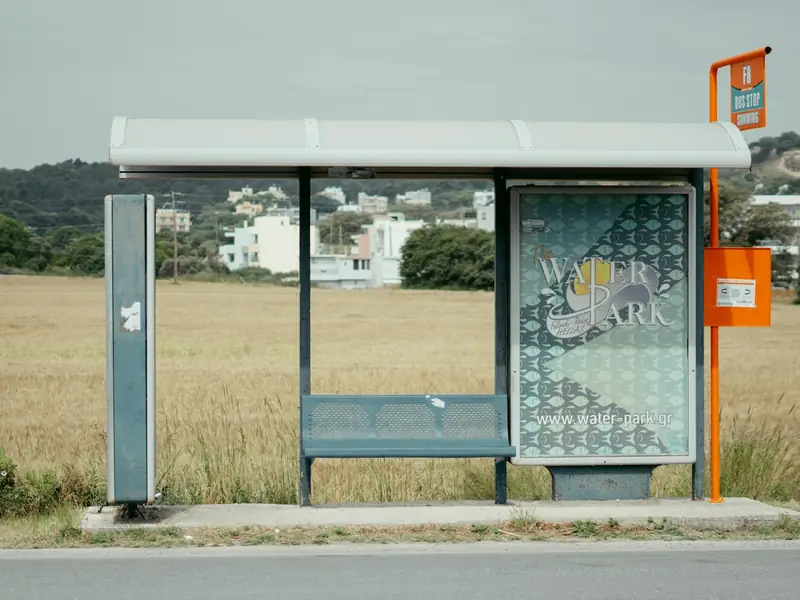 A bus shelter with an advertising panel