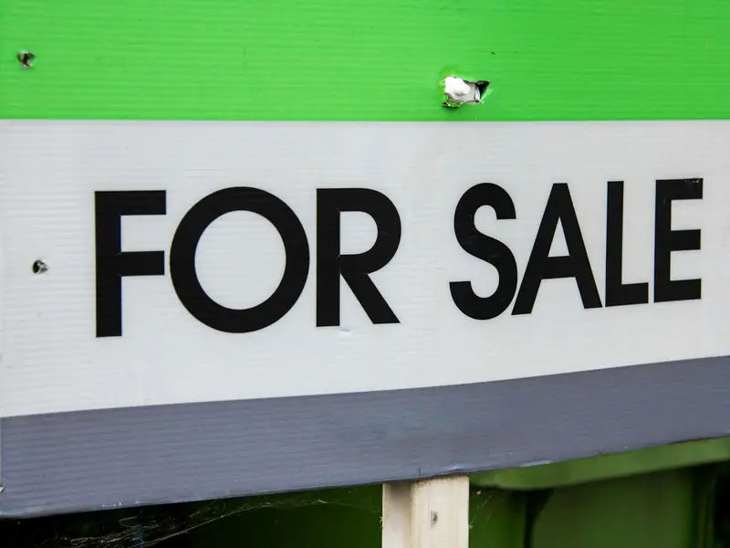 A For Sale sign outside a house