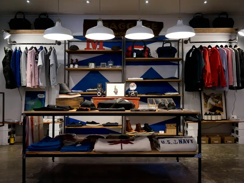 Shirts and jackets on rails in a menswear shop