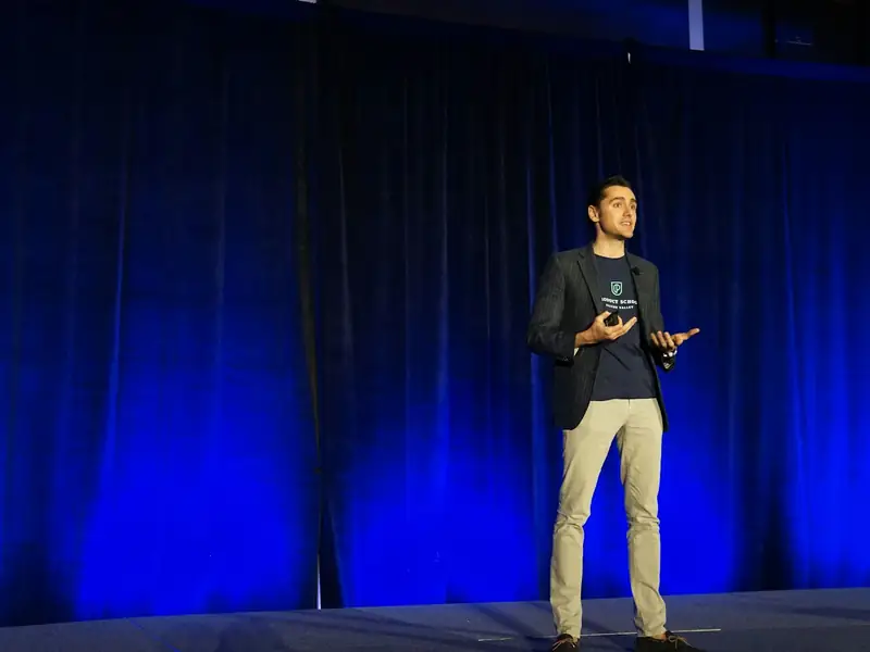 A speaker presenting on a stage