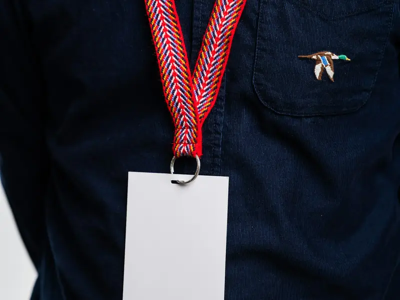 A conference badge on a lanyard